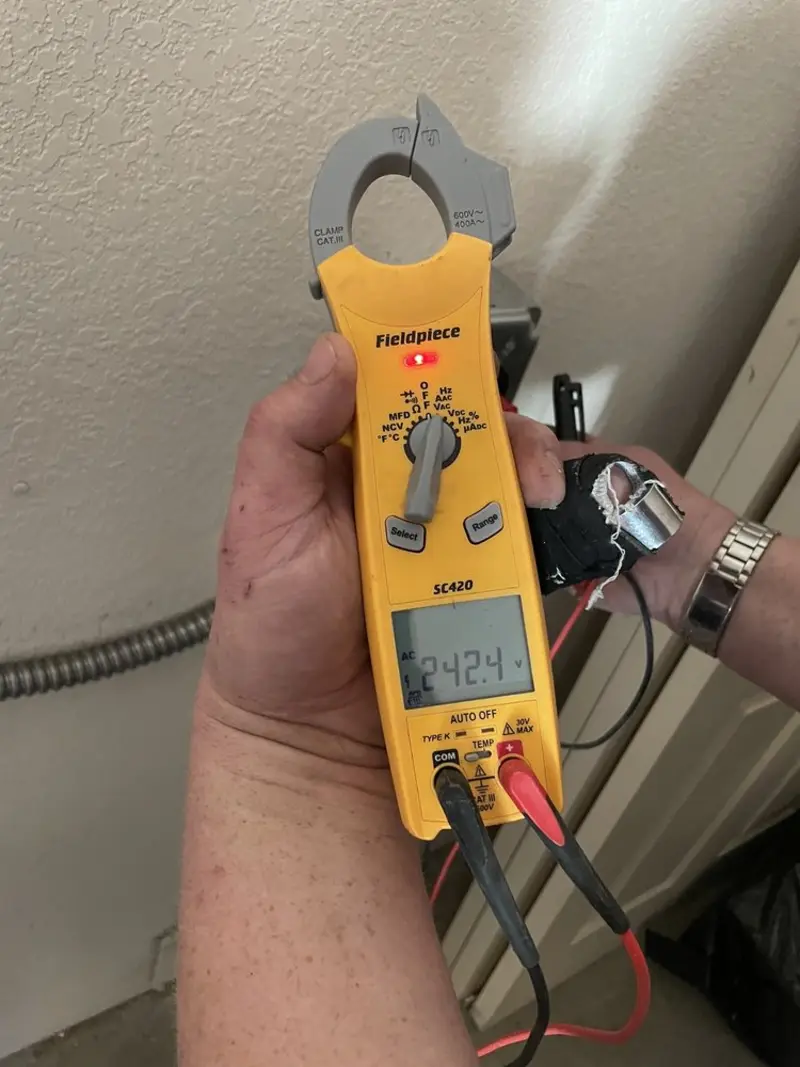 Voltage testing with clamp meter during Recessed Lighting Installation in Hillside